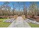 Wooden bridge over community trail in a wooded area at 117 Swan Dr, Summerville, SC 29485
