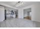 Open concept kitchen with white cabinets, tile flooring, and a view to the living room at 117 Swan Dr, Summerville, SC 29485