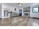Open-concept layout connects the kitchen and living room with a brick fireplace, creating a warm and inviting space at 117 Swan Dr, Summerville, SC 29485