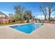 Backyard swimming pool with blue water, concrete patio, and chairs, surrounded by a wooden fence at 117 Swan Dr, Summerville, SC 29485