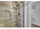 Tiled shower featuring glass doors, dual shower heads and recessed niche, perfect for storing bathing essentials at 117 Swan Dr, Summerville, SC 29485