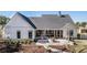 Charming backyard with a patio, screened porch, and well-maintained landscaping at 1174 Hitchfield Ln, Awendaw, SC 29429