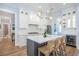 Bright eat-in kitchen featuring an island with seating and stainless steel appliances at 1174 Hitchfield Ln, Awendaw, SC 29429