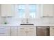 Bright eat-in kitchen featuring white cabinets and stainless steel appliances at 1174 Hitchfield Ln, Awendaw, SC 29429