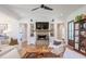 Comfortable living room with a brick fireplace, built-in shelves, and an open layout at 1174 Hitchfield Ln, Awendaw, SC 29429