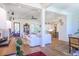Bright living room with white shiplap walls, wood floors, and an open layout at 1174 Hitchfield Ln, Awendaw, SC 29429