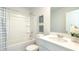 Bright bathroom with white cabinets, tub, shower, and decorative accents at 127 River Hill Rd, Goose Creek, SC 29445