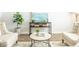 Cozy living room with neutral-toned furniture, decor, hardwood floors, and plenty of natural light at 127 River Hill Rd, Goose Creek, SC 29445