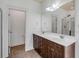 Bathroom featuring double sinks with stylish cabinets and a shower room visible from the mirror at 1331 Appling Dr, Mount Pleasant, SC 29464