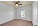 Small bedroom featuring a window, neutral walls, plush carpet, and fan at 1331 Appling Dr, Mount Pleasant, SC 29464