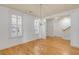 Bright dining room with hardwood floors, a chandelier, and white plantation shutters, enhancing the room's elegance at 1331 Appling Dr, Mount Pleasant, SC 29464