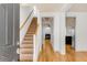 Bright foyer with hardwood floors and staircase, leading to an open layout with views of the living area and kitchen at 1331 Appling Dr, Mount Pleasant, SC 29464