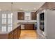 Modern kitchen with stainless steel appliances, granite countertops, and brown cabinets offers plenty of room and style at 1331 Appling Dr, Mount Pleasant, SC 29464