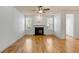 Bright living room featuring hardwood floors, a cozy fireplace, and ample natural light from well placed windows at 1331 Appling Dr, Mount Pleasant, SC 29464