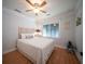 Bright bedroom featuring a white ceiling fan, wood floors, and serene natural light at 1344 Pickett St, Charleston, SC 29412