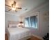 Comfortable bedroom with a wooden ceiling fan, wainscoting, and a serene ambiance at 1344 Pickett St, Charleston, SC 29412
