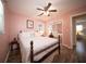 Inviting bedroom with wood floors, soft pink walls, and a mirrored closet door at 1344 Pickett St, Charleston, SC 29412