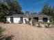 Charming brick ranch-style home with a well-manicured lawn and mature trees at 1344 Pickett St, Charleston, SC 29412