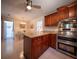 Charming kitchen featuring wooden cabinetry, granite countertops, and modern stainless steel appliances at 1344 Pickett St, Charleston, SC 29412