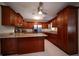 Open kitchen with stainless steel appliances, granite countertops, and custom wood cabinets at 1344 Pickett St, Charleston, SC 29412