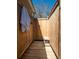 Private outdoor shower featuring wood plank floors and walls, with a convenient bench and towel hook at 1344 Pickett St, Charleston, SC 29412