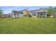 Spacious backyard featuring lush green grass, storage shed, and fenced perimeter at 140 Satur Dr, Goose Creek, SC 29445