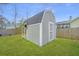 A gray storage shed sits within the home's grassy backyard at 140 Satur Dr, Goose Creek, SC 29445