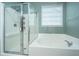 Well-lit bathroom with a separate shower and soaking tub combination at 140 Satur Dr, Goose Creek, SC 29445