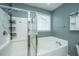 Well-lit bathroom with a separate shower and soaking tub combination at 140 Satur Dr, Goose Creek, SC 29445