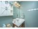 Stylish half bathroom featuring a charming barn door style medicine cabinet and modern fixtures at 140 Satur Dr, Goose Creek, SC 29445
