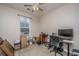 Bedroom currently used as an office featuring a ceiling fan and natural light at 140 Satur Dr, Goose Creek, SC 29445