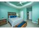 Relaxing bedroom featuring a tray ceiling and ensuite bathroom at 140 Satur Dr, Goose Creek, SC 29445