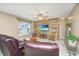 Comfortable living room featuring a wood accent wall and a large leather couch at 140 Satur Dr, Goose Creek, SC 29445