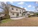 Expansive backyard featuring a patio, lush lawn, and mature trees, perfect for outdoor living at 1458 Clarendon Way, Mount Pleasant, SC 29466