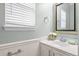 Cozy bathroom featuring a vanity with framed mirror, fresh flowers, and stylish fixtures at 1458 Clarendon Way, Mount Pleasant, SC 29466
