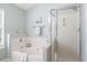 Bright bathroom featuring a soaking tub, glass-enclosed shower, and decorative accents at 1458 Clarendon Way, Mount Pleasant, SC 29466