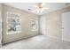 Bright bedroom with neutral walls, and two windows showing an exterior view at 1458 Clarendon Way, Mount Pleasant, SC 29466