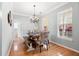 Bright dining room with hardwood floors and a charming chandelier at 1458 Clarendon Way, Mount Pleasant, SC 29466