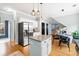 Bright, airy kitchen with stainless steel appliances, granite island, and modern pendant lighting at 1458 Clarendon Way, Mount Pleasant, SC 29466