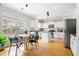 Eat-in kitchen with stainless steel appliances, modern cabinetry, and a window overlooking the backyard at 1458 Clarendon Way, Mount Pleasant, SC 29466