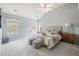 Serene main bedroom featuring plush carpeting, neutral tones, and lots of natural light for relaxation at 1458 Clarendon Way, Mount Pleasant, SC 29466