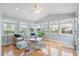 Inviting sunroom with lots of natural light, cozy seating, and serene views of the outdoors at 1458 Clarendon Way, Mount Pleasant, SC 29466