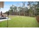 Expansive backyard with lush green grass and mature trees, perfect for outdoor entertaining at 146 Brant Dr, Summerville, SC 29483