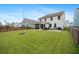 Expansive backyard featuring a well-manicured lawn, patio area, and privacy fencing, ideal for outdoor activities at 146 Brant Dr, Summerville, SC 29483