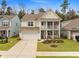Charming two-story home with a welcoming front porch, well-manicured lawn, and attached two-car garage at 146 Brant Dr, Summerville, SC 29483
