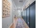 Long hallway with beautiful wood floors and decorative wall accents at 146 Brant Dr, Summerville, SC 29483