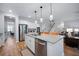 Modern kitchen with an island, barstool seating and a view of the stairs and a room with a desk at 146 Brant Dr, Summerville, SC 29483