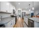 Galley kitchen with stainless appliances, granite countertops, and bright cabinetry at 146 Brant Dr, Summerville, SC 29483
