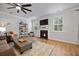 Comfortable living room with a fireplace, plush rug, and a large ceiling fan at 146 Brant Dr, Summerville, SC 29483