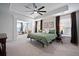 Serene main bedroom featuring tray ceilings, large windows, and soothing color palette at 146 Brant Dr, Summerville, SC 29483